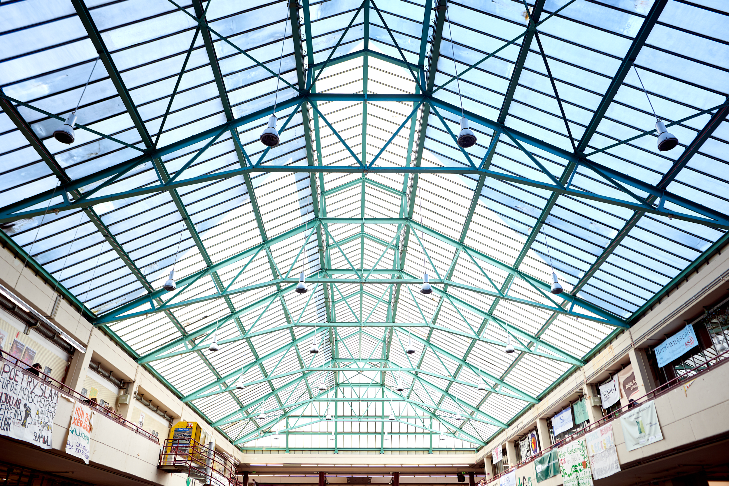 Glass roof with green steel frame of the main building
